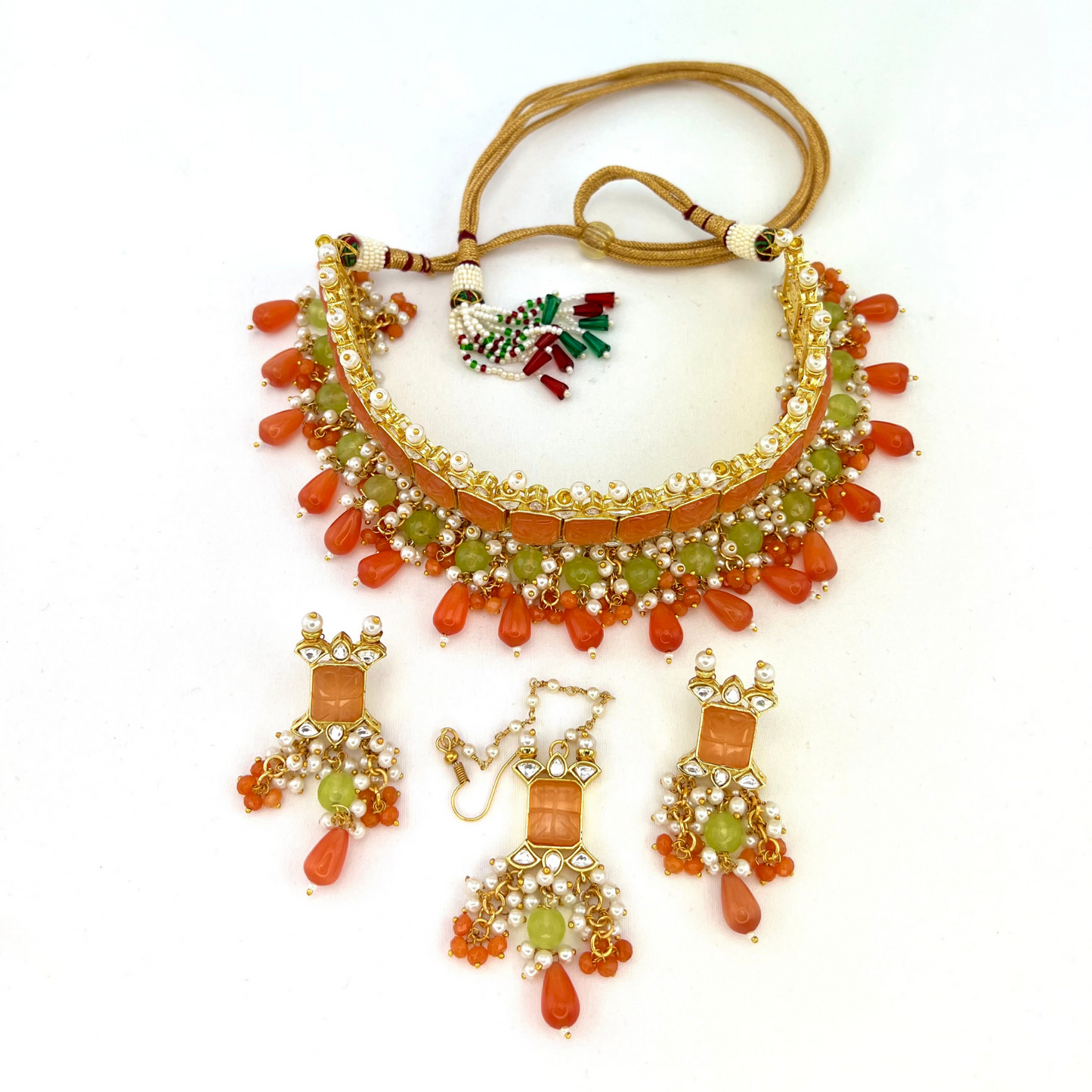 Choker set with with peach, clear stones and green, peach and orange beads,  Set includes choker, tikka and earrings.  Prefect for Indian weddings, parties and special occasions.  Latest 2022 fashion. High end Indian fashion jewellery with top quality stones and beads.