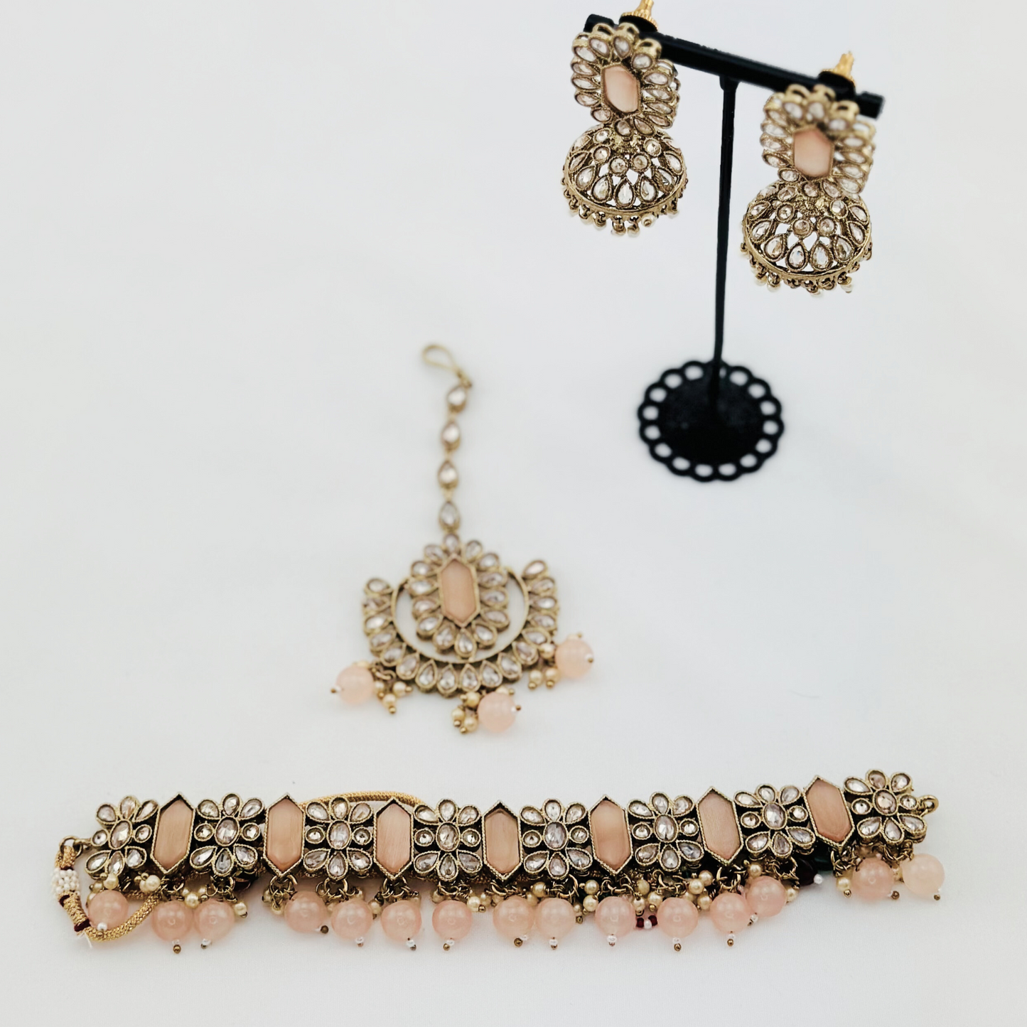 Choker set with baby pink beads and stones.  Set includes necklace, tikka & earrings.  Prefect for Indian weddings, parties and special occasions.   Latest 2023 fashion. High end Indian fashion jewellery with top quality stones and beads.