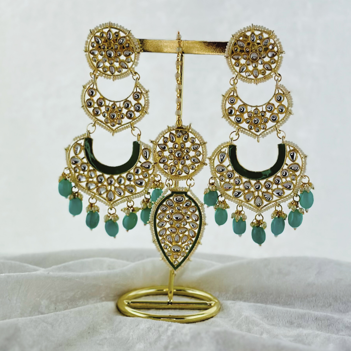 Tikka & Earring Set in turquoise.   High quality beads, pearls and stone work.   Latest 2023 fashion for weddings, parties and special occasions 
