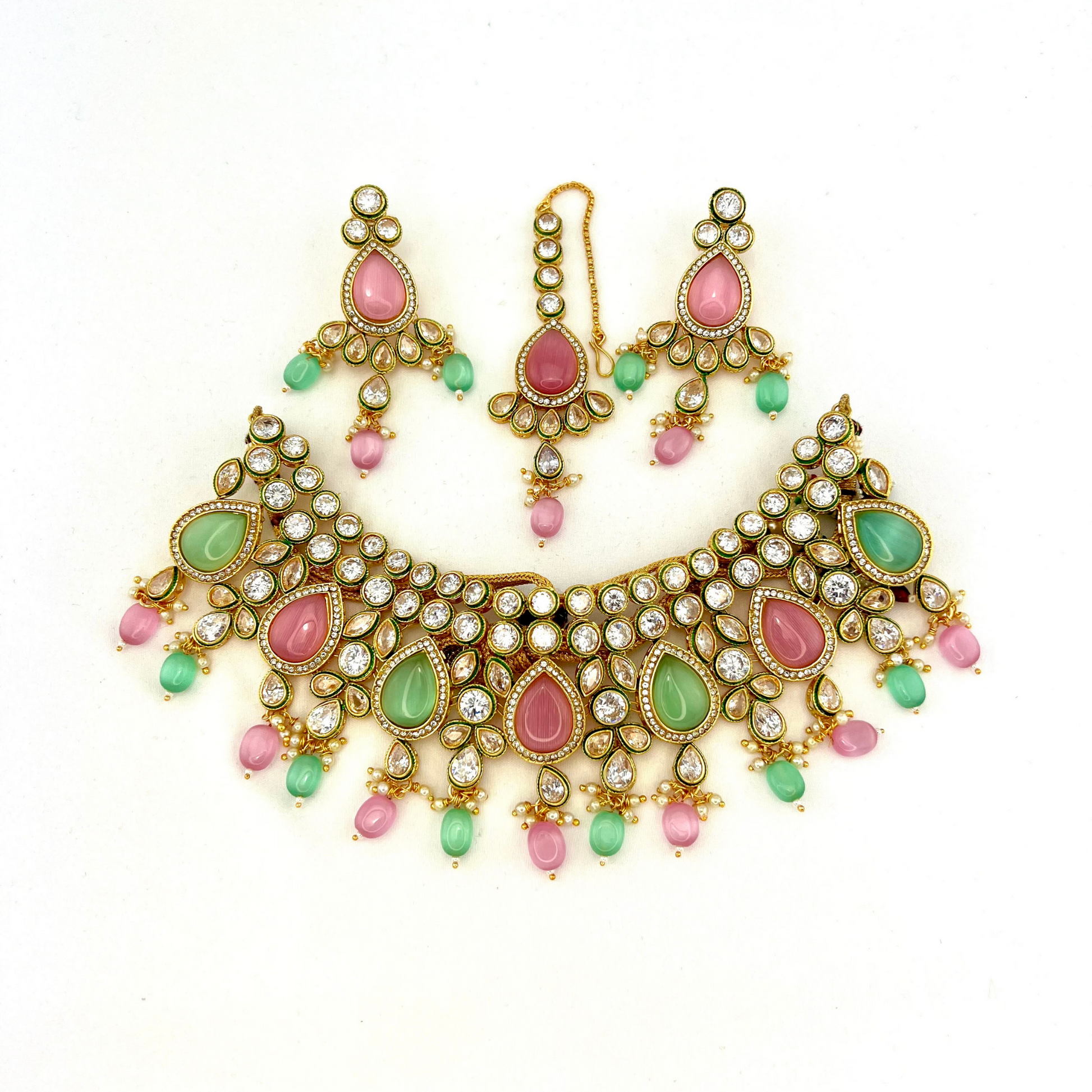 Necklace set with green, pink and clear stones and green and pink beads.  Set includes necklace, tikka and earrings.  Prefect for Indian weddings, parties and special occasions.   Latest 2022 fashion. High end Indian fashion jewellery with top quality stones and beads.