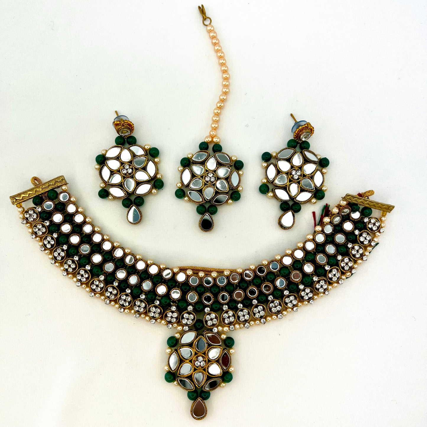 Mirror necklace set with forest green beads, clear stones and pearls.  Set includes, necklace, tikka and earrings.  Prefect for Indian weddings, parties and special occasions.  Latest 2022 fashion. High end Indian fashion jewellery with top quality stones and beads.