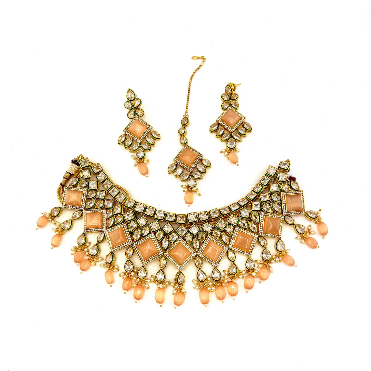 Necklace set with peach beads and peach and clear stone.  Set includes necklace, tikka & earrings.  Prefect for Indian weddings, parties and special occasions.   Latest 2022 fashion. High end Indian fashion jewellery with top quality stones and beads.