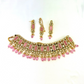 Necklace set with pink beads and clear and pink stones.  Set includes necklace, tikka and earrings.  Prefect for Indian weddings, parties and special occasions.  Latest 2022 fashion. High end Indian fashion jewellery with top quality stones and beads.