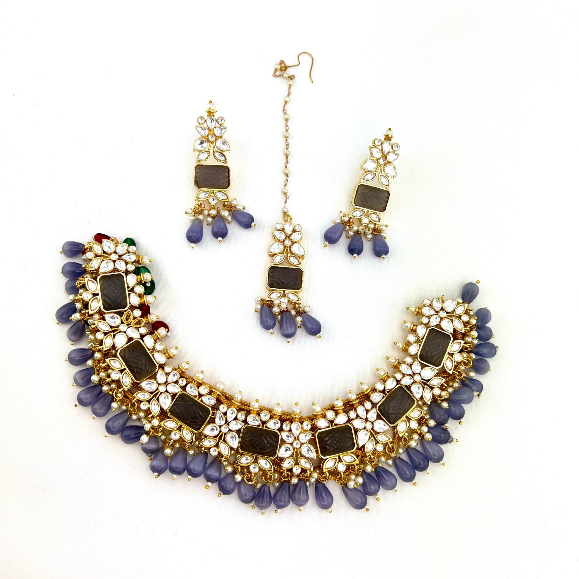 Necklace set with lavender beads, clear and lavender stones.  Set includes necklace, tikka & earrings.  Prefect for Indian weddings, parties and special occasions.   Latest 2022 fashion. High end Indian fashion jewellery with top quality stones and beads.