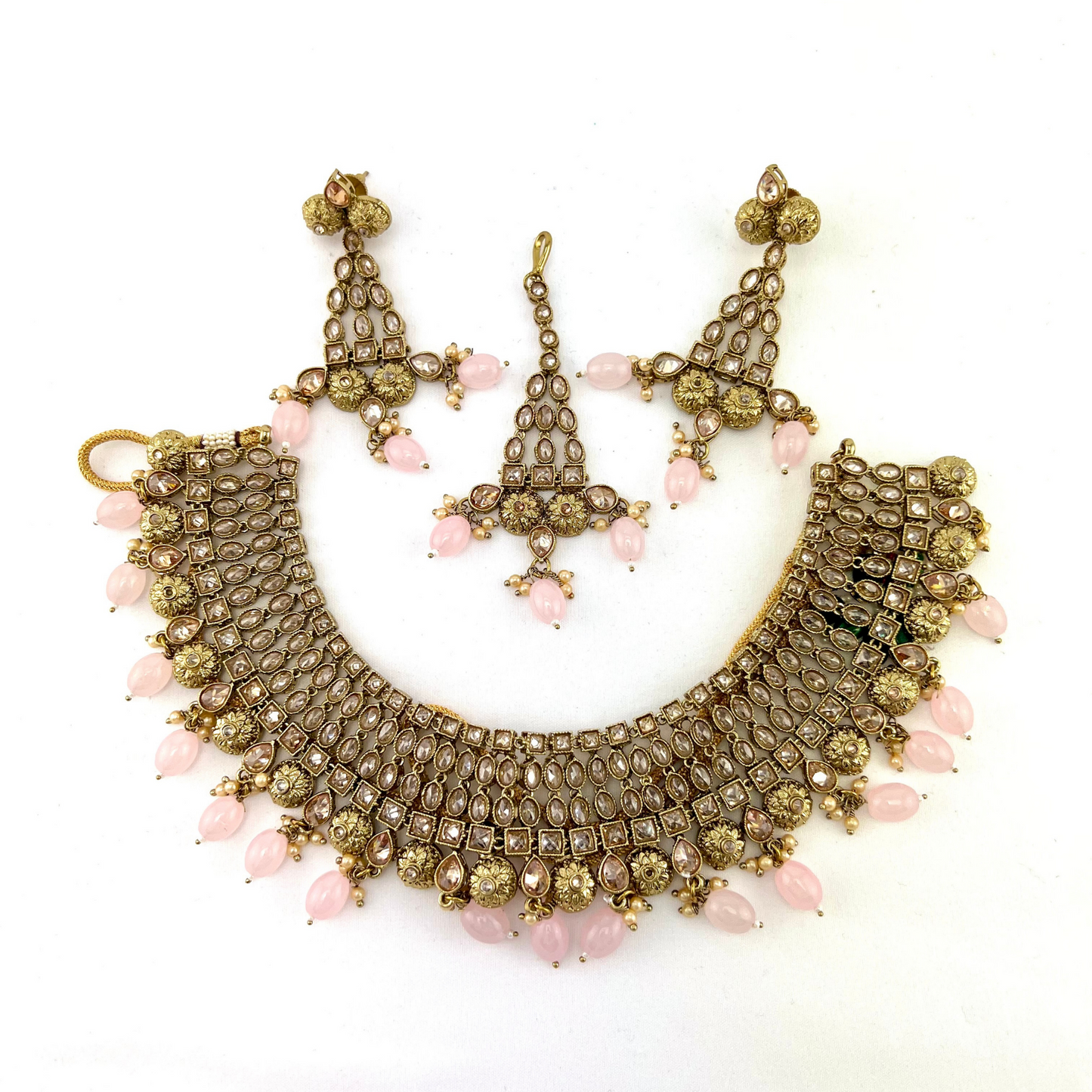 Necklace set with pink  beads and gold stone work.  Set includes necklace, tikka and earrings.  Prefect for Indian weddings, parties and special occasions.   Latest 2022 fashion. High end Indian fashion jewellery with top quality stones and beads.