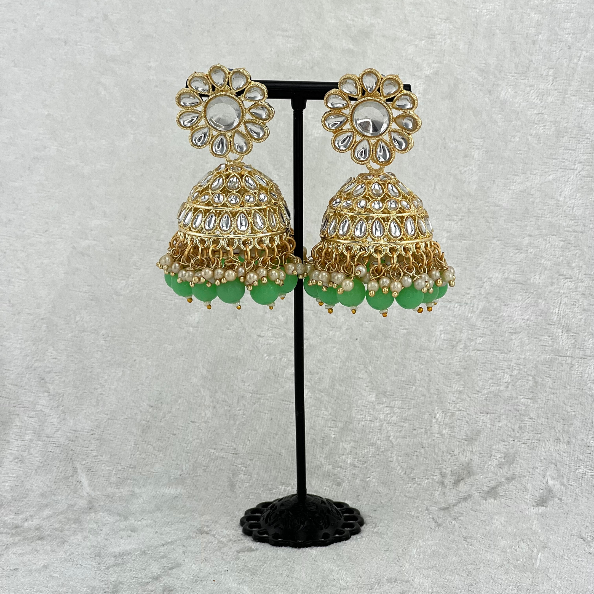 Jhumka earrings in mint green with stones, pearls and beads. Indian wedding jewellery prefect for weddings, parties and special occasions. latest high quality 2022 fashion
