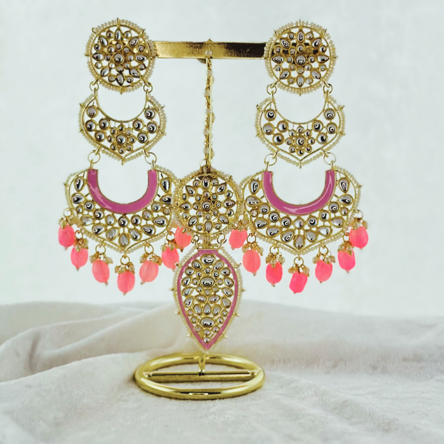 Tikka & Earring Set in pink.   High quality beads, pearls and stone work.   Latest 2023 fashion for weddings, parties and special occasions 