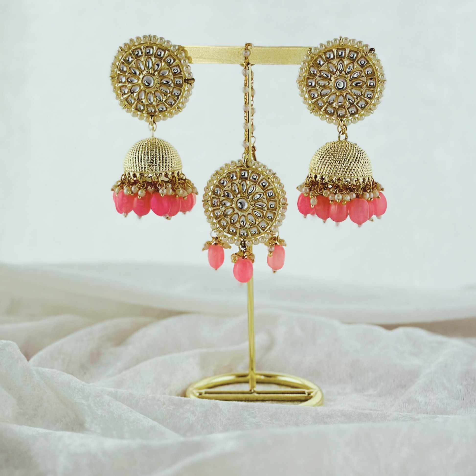 Tikka & earring set in pink.  High quality beads, pearls and stone work.   Latest 2023 fashion for weddings, parties and special occasions 