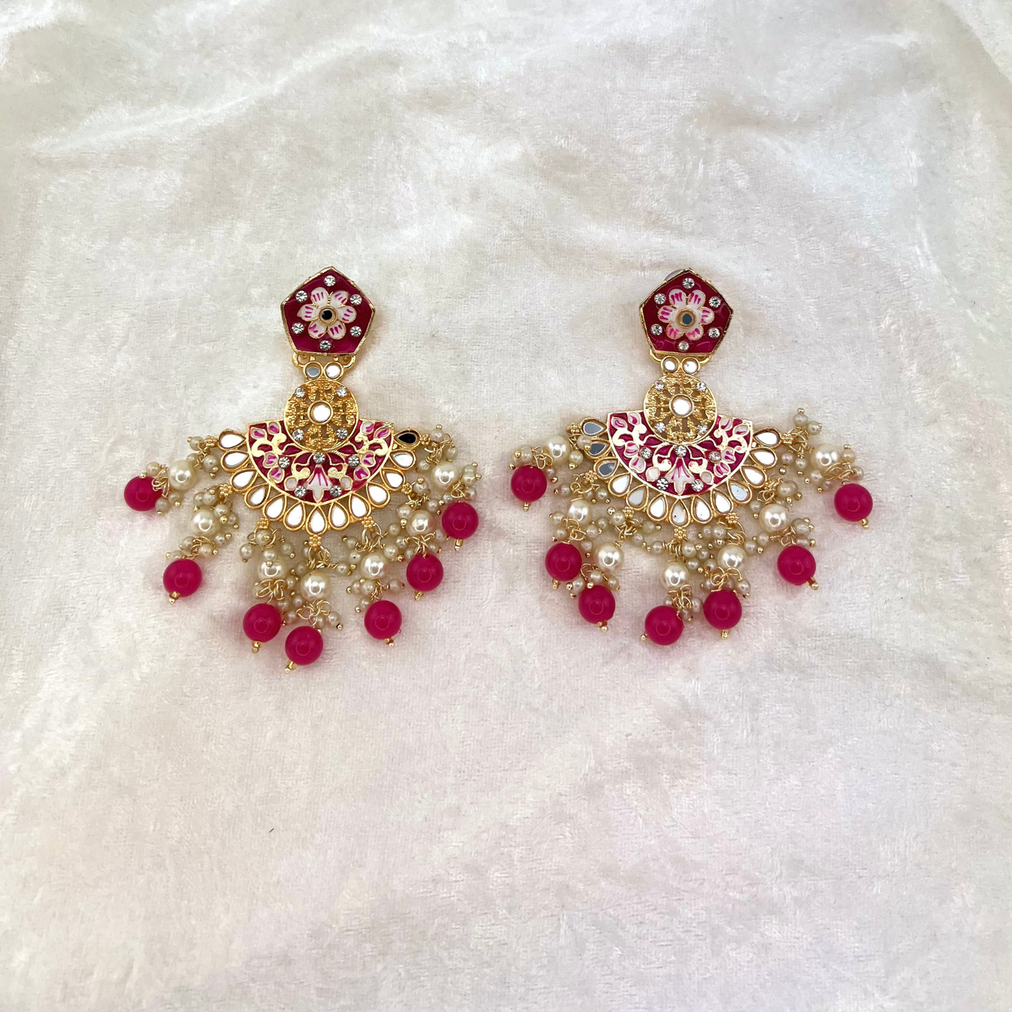 High quality hand painted earrings in Hot Pink with pearls, beads, mirrors and stone work. Latest 2022 indian jewellery for weddings, parties and special occasions.